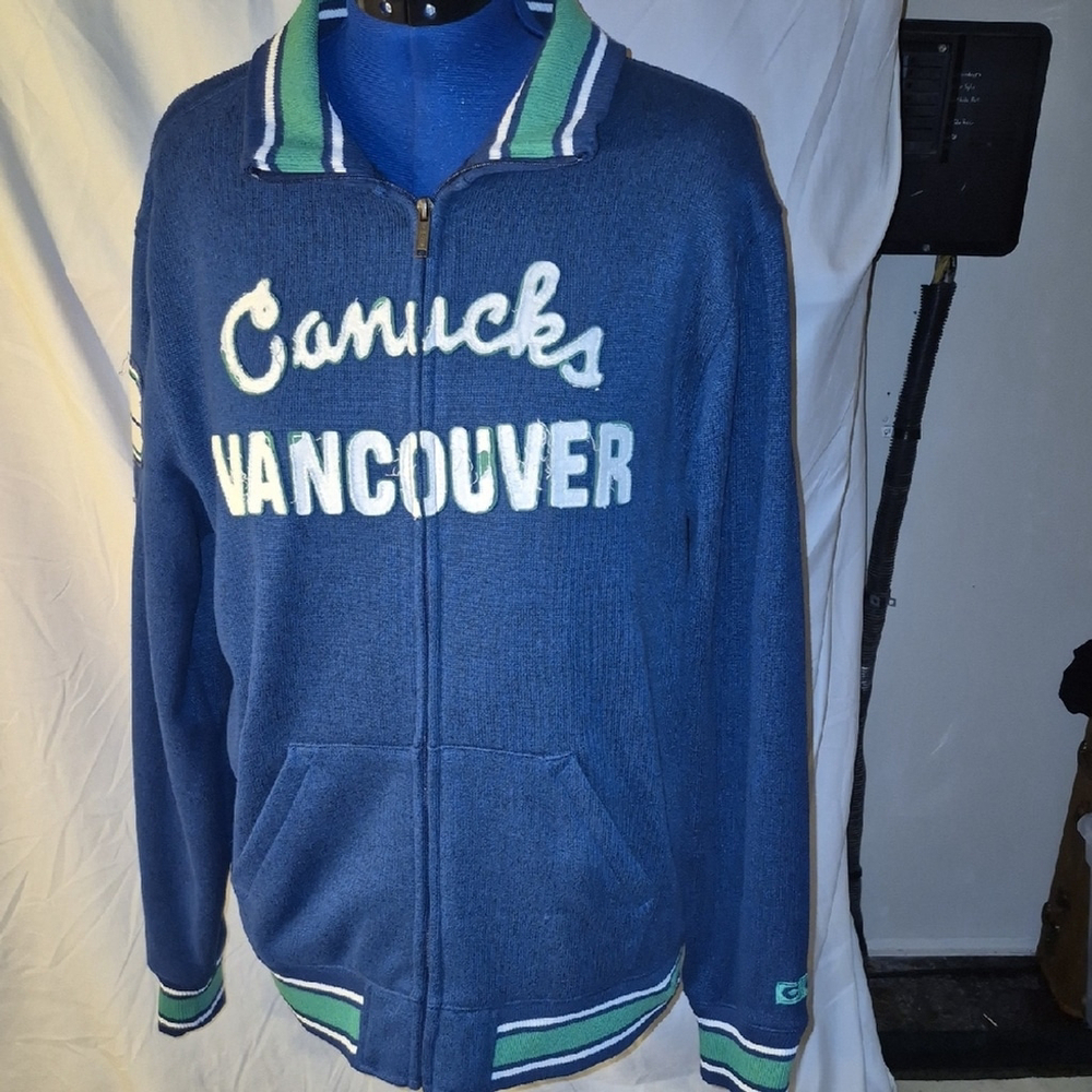 CCM: Blue/Green/white Vancouver Canucks Zip-Up Jacket.(#2014) Sz.large.